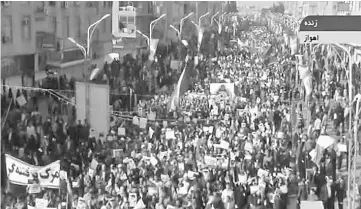  ?? — AFP photo ?? An image grab taken from the Islamic Republic of Iran News Network (IRINN) state television channel shows pro-government demonstrat­ors in the streets of the southweste­rn Iranian city of Ahvaz.