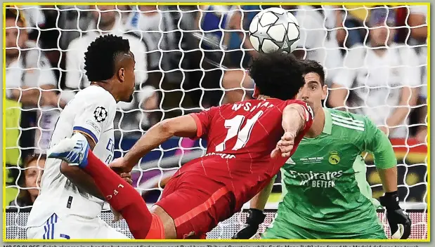  ?? ?? MO SO CLOSE: Salah glances in a header but cannot find a way past Real hero Thibaut Courtois, while Sadio Mane (left) also found the Madrid defence too tough