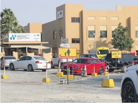  ??  ?? Above, Greenfield Internatio­nal School car park. Right, four-year-old Insiya Vajihi and her mother were crushed between the reversing vehicle and a parked car Leslie Pableo for The National; Dubai Police