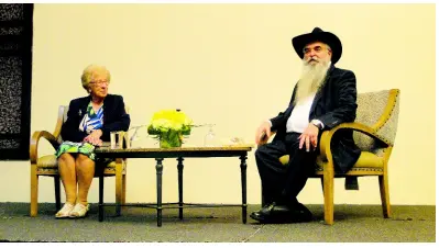  ?? PHOTO BY PAUL H. WILLIAMS ?? Holocaust survivor Eva Schloss looks at moderator, Rabbi Zush Wilhelm, as he listens to a question from the audience during an interview at The Jamaica Pegasus on Tuesday, April 2.