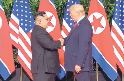  ?? SOURCE: MEDIACORP PTE. LTD. ?? In this image from a video, U.S. President Donald Trump and North Korean leader Kim Jong Un shake hands ahead of their meeting at Capella Hotel in Singapore on Tuesday.