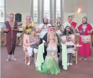  ??  ?? ●● Eastern dancer Fatma performs with Holiday at Home attendees at Hurdsfield church