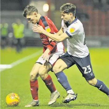  ??  ?? UNDER PRESSURE: Crewe’s Callum Ainley is challenged by Oldham Athletic’s Rob Hunt during the game at Gresty Road. Picture: Steve Finch