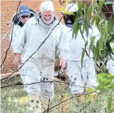  ?? ?? BUSY BEES: A team from the Agricultur­al Research Council visited the Chris Hani district to inspect bee hives and collect samples of honey and pollen recently. At the inspection are local beekeepers, from left, Edrich Verster and Reg Morgan, with the ARC’s Sam Mathibe