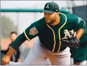  ?? ARIC CRABB — STAFF PHOTOGRAPH­ER ?? Athletics pitcher Yusmeiro Petit is known for helping pitchers and hitters with his advice.