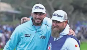  ?? RAY ACEVEDO/USA TODAY SPORTS ?? Max Homa and caddie Joe Greiner celebrate Homa’s first victory in a PGA Tour tournament Saturday, the Farmers Insurance Open.