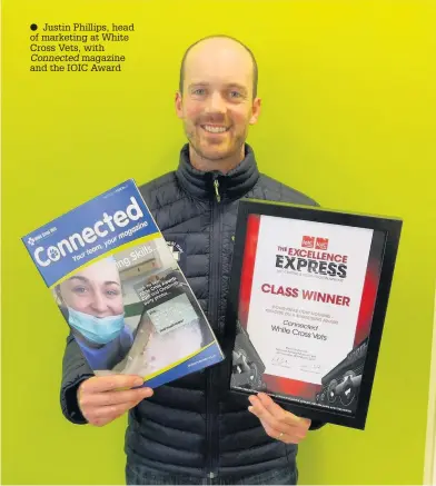  ??  ?? Justin Phillips, head of marketing at White Cross Vets, with Connected magazine and the IOIC Award
