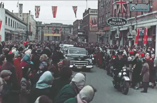  ?? PHOTOS: NATIONAL FILM BOARD ?? Huge crowds lined Rose Street as the procession carrying Princess Elizabeth and Prince Philip headed south from Union Station, now Casino Regina.