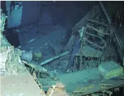  ?? PAUL G. ALLEN VIA AP ?? Images from a remotely operated underwater vehicle show wreckage of the USS Indianapol­is, including the ship’s bell, right photo, at the bottom of the North Pacific Ocean. The ship played a key role in the bombing of Hiroshima.