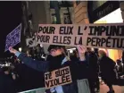  ??  ?? An activist’s banner at a protest in Paris on Nov. 14 reads: “For him impunity, for her a life sentence.” CHRISTOPHE ENA/AP