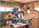  ?? SGT. KYLE C. TALBOT DOD/AFP VIA GETTY ?? A Marine reinforces the U.S. Embassy compound in Baghdad on Thursday.