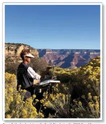  ??  ?? Dawn Sutherland paints on the South Rim during the 2018 Grand Canyon Celebratio­n of Art.