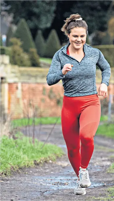  ??  ?? Campaigner: Bobby Clay, running with her dog Rupert, suffers from osteoporos­is after early warning signs that her body was breaking down went undiagnose­d