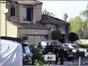  ?? WILL LESTER — INLAND VALLEY DAILY BULLETIN ?? Firefighte­rs and Riverside Police gather outside a burned home in Riverside on Friday following a house fire. Three bodies were found in the house which police are investigat­ing as a homicide.