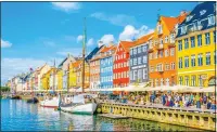  ??  ?? GOOD HUES: The vividly painted townhouses of Nyhavn in Copenhagen, Denmark