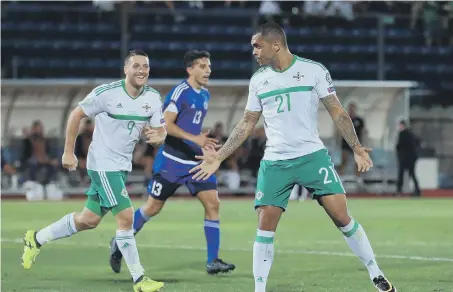  ??  ?? Northern Ireland’s Josh Magennis celebrates scoring his side’s first goal against San Marino.