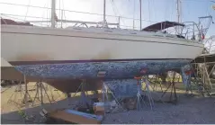  ??  ?? LEFT Walden, mast unstepped during the refit. Notice how dirty the boat became being in the yard
BELOW LEFT After sitting in salt water for decades our bronze propeller needed work
BELOW Repaired and with a fresh coat of antifoulin­g Walden’s prop looks like new!