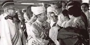  ??  ?? Sultan of Kedah Sultan Abdul Halim Mu’adzam Shah at his installati­on as the 5th Yang di-Pertuan Agong in 1970. With him is the first prime minister, Tunku Abdul Rahman Putra Al-Haj.