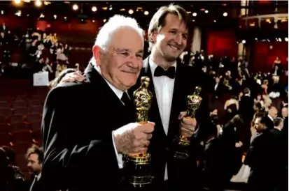  ?? CHRIS CARLSON/ASSOCIATED PRESS ?? Mr. Seidler (left) and Tom Hooper with Oscar trophies for “The King’s Speech” in 2011.