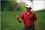  ?? SETH WENIG — THE ASSOCIATED PRESS ?? Matthew Wolff reacts after a shot on the 11th hole during the second round of the Travelers Championsh­ip on Friday in Cromwell, Conn.