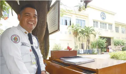  ?? SUNSTAR FOTO / RUEL ROSELLO ?? DREAMS DO COME TRUE. Security guard and licensed teacher Erwin Macua will soon have a different working environmen­t after he was hired to teach in the St. Theresa’s College’s grade school department.