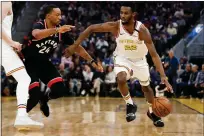  ?? RANDY VAZQUEZ — BAY AREA NEWS GROUP, FILE ?? The Warriors’ Andrew Wiggins dribbles past the Raptors’ Norman Powell during the second quarter of their March 5game at Chase Center in San Francisco.