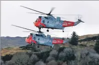  ?? Photograph: Stephen Lawson ?? Two of the Sea King choppers.