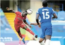  ?? Picture: GETTY IMAGES/MICHAEL REGAN ?? ON TARGET: Liverpool’s Sadio Mane scores his team’s first goal during their Premier League match against Chelsea on Sunday