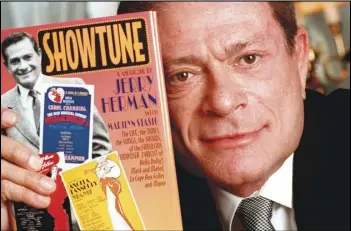  ?? Associated Press files ?? Composer Jerry Herman displays his book “Showtune,” in New York in 1996. Herman, the Tony Award-winning composer behind “Hello, Dolly!” and “La Cage aux Folles,” has died at age 88.