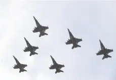  ?? CP FILE PHOTO ?? CF-18 Hornets fly in formation near Cold Lake, Alberta, in 2014.