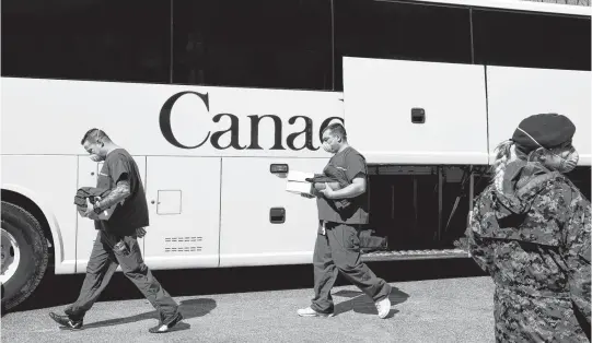  ?? CHRISTINNE MUSCHI • REUTERS ?? A bus carrying Canadian Armed Forces medical personnel arrives at Villa Val des Arbres, a seniors long-term care centre in Montreal, to help amid the outbreak of the coronaviru­s disease.