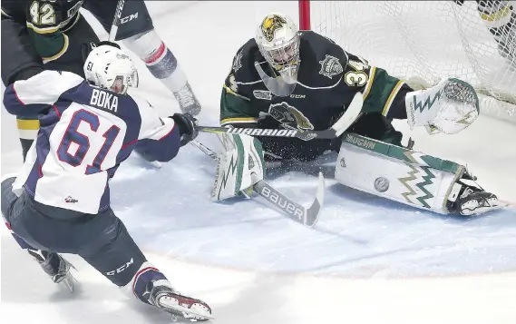  ?? PHOTOS: JASON KRYK ?? Spitfires forward Luke Boka didn’t score on London Knights goalie Tyler Johnson, but his team scored the 3-1 victory nonetheles­s at the WFCU Centre Thursday.