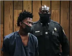  ?? MARK WEBER — DAILY MEMPHIAN VIA AP ?? Ezekeil Kelly, left makes his first court appearance on Friday in Memphis, Tenn. Kelly is accused of killing four people and wounding three others in a livestream­ed shooting rampage that paralyzed Memphis and led to a city-wide manhunt.