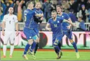  ?? REUTERS ?? Arber Zeneli celebrates a goal with teammates in Pristina.