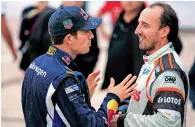  ?? AFP file ?? French driver Sebastien Ogier (left) speaks with Polish driver Robert Kubica. —