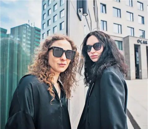  ?? ?? Maria Alyokhina (left) and Olga Barisova of the punk band Pussy Riot in Berlin, where they have been on tour after she escaped from house arrest in Moscow