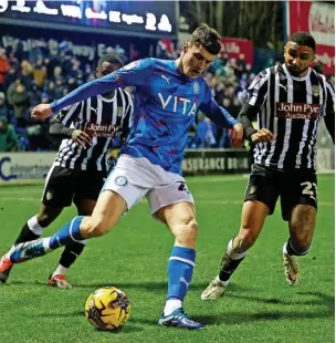  ?? Www.mphotograp­hic.co.uk ?? ●●Joel Cotterill shields the ball against Notts County