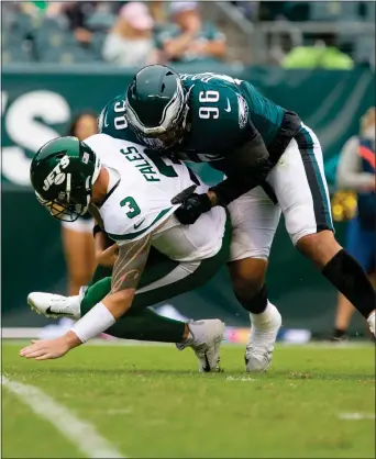  ?? RICH HUNDLEY III — FOR THE TRENTONIAN ?? Eagles defensive end Dereck Barnett (96) sacks Jets quarterbac­k David Fales (5) during Sunday’s game in Philadelph­ia.