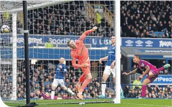  ??  ?? Gabriel Jesus heads home Manchester City’s second goal at Goodison Park