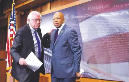  ?? — AP ?? WASHINGTON: In this Sept 10, 2015 file photo, Sen Bernie Sanders, I-Vt, left, and Rep Elijah Cummings, D-Md, leave a news conference on Capitol Hill.