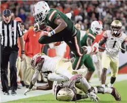  ?? AL DIAZ adiaz@miamiheral­d.com ?? Miami will face Florida State and Florida in the same season for the first time since 2013. The Hurricanes beat the Gators but lost to the Seminoles that year.