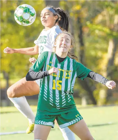  ?? APRIL GAMIZ/THE MORNING CALL ?? Emmaus’ Mya Cooper, back, and Central Catholic’s Meredith Eisenmann battle for position during an EPC playoff game Monday in Allentown.