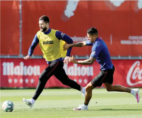  ?? Reuters ?? Atletico Madrid’s Felipe and Vitolo during training on Monday at Ciudad Deportiva Wanda Atletico de Madrid training ground.