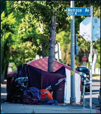  ??  ?? DIVIDED CITY: More tents in Melrose Place, one of the trendiest addresses in Los Angeles