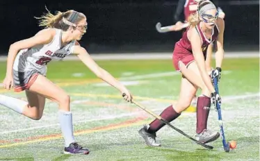  ?? BRIAN KRISTA/BALTIMORE SUN MEDIA GROUP PHOTOS ?? Glenelg’s Leanne Duncan, left, can’t reach the ball Monday as Hereford’s Kailyn Brandt plays it away from the goal. “This was a huge victory for us,” said Bulls coach Caitlin Duvall, whose team will play Kent Island for the Class 2A state title.