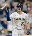  ?? John Fisher / Getty Images ?? Willy Adames of the Brewers flips his bat after hitting a two run homer to tie the game in the ninth inning against the Rockies Friday.