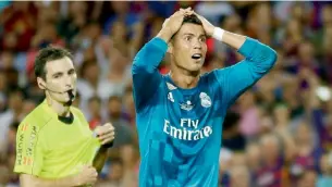  ?? AP file ?? Real Madrid’s Cristiano Ronaldo reacts after referee Ricardo de Burgos shows a second yellow card during the Spanish Super Cup, first leg, match against Barcelona on Sunday. —
