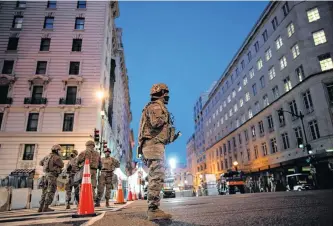  ?? EDUARDO MUNOZ • REUTERS ?? National Guard members get instructio­ns as others stand guard near the White House on Tuesday ahead of U.S. President-elect Joe Biden’s inaugurati­on in Washington today.