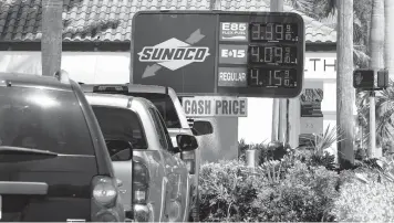  ?? MARTA LAVANDIER/AP ?? The Heritage Foundation says that President Biden’s energy policies are helping drive inflation higher. Above, cars at a gas station April 13 in Delray Beach, Florida.