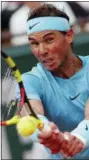  ?? THIBAULT CAMUS — THE ASSOCIATED PRESS ?? Rafael Nadal returns a shot against Diego Schwartzma­n during their quarterfin­al match at the French Open at the Roland Garros stadium in Paris, France, Wednesday.